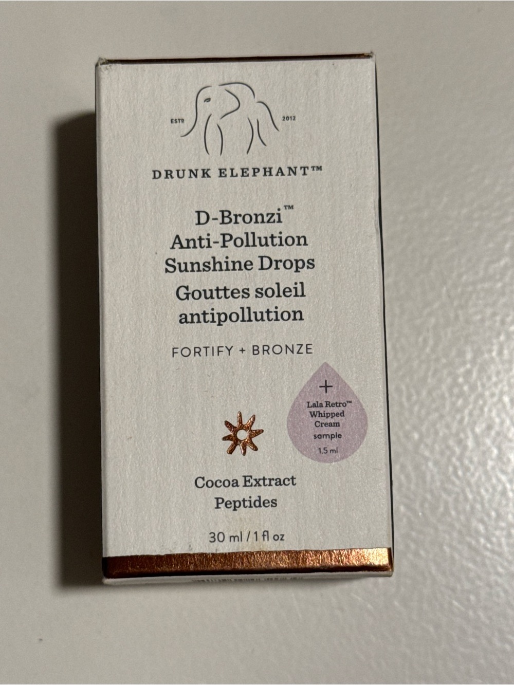 Drunk Elephant D-Bronzi Fortifying Bronze Tint - White & Brown Packaging